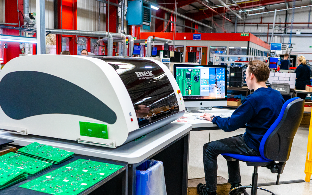 Apprentice working in a production facility