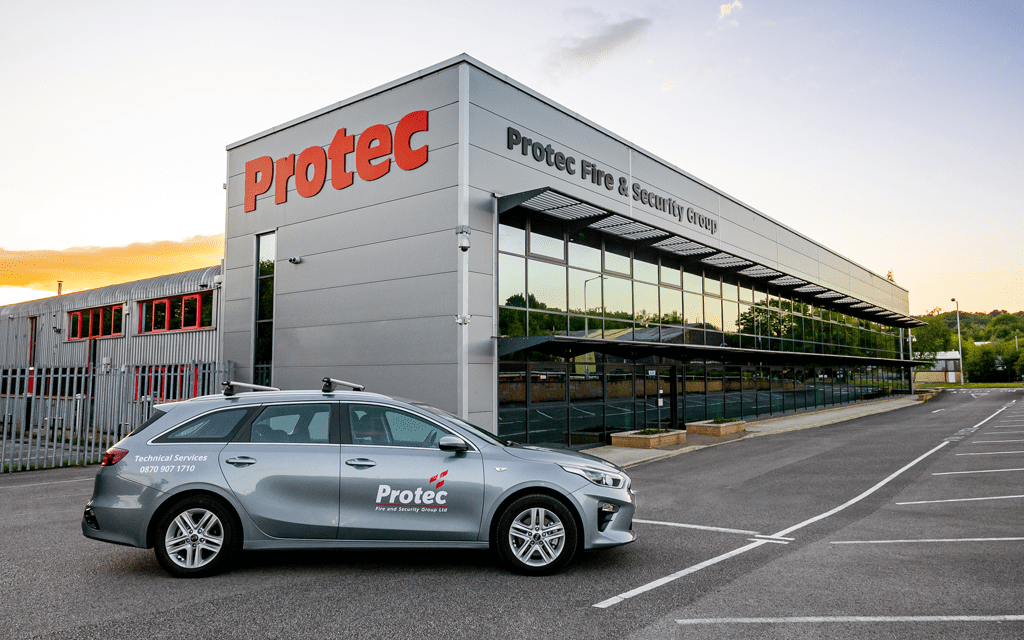 Protec Service car in front of building